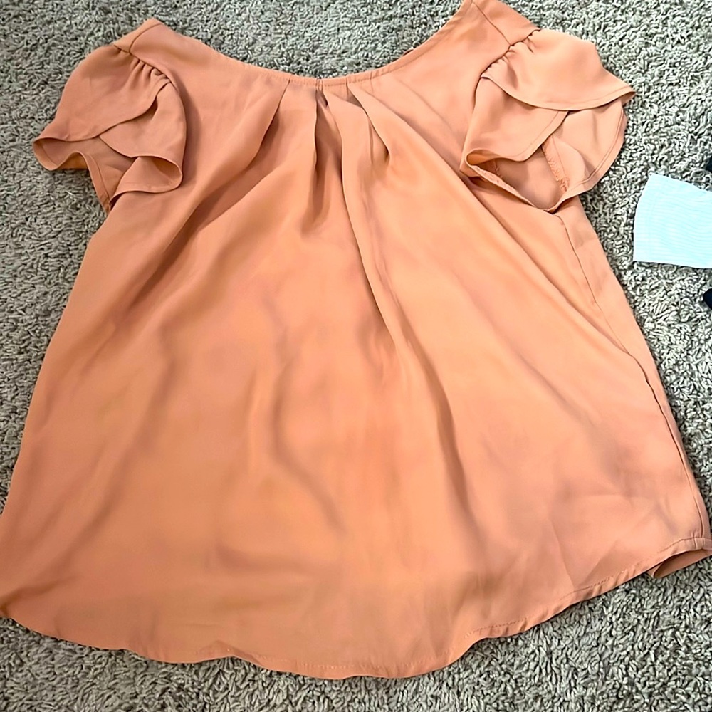 Smooth, light brown dress shirt circle neck.